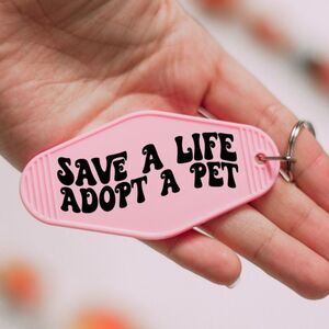 Save a life Adopt a Pet NEW Pink Motel Keychain